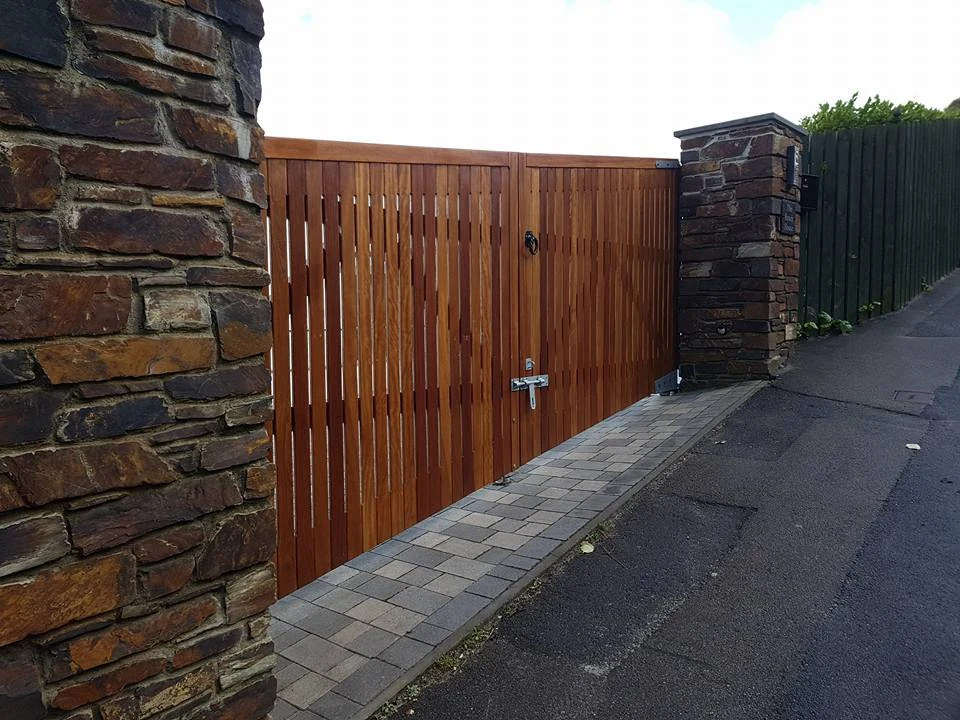 Timber gates between stone pillars
