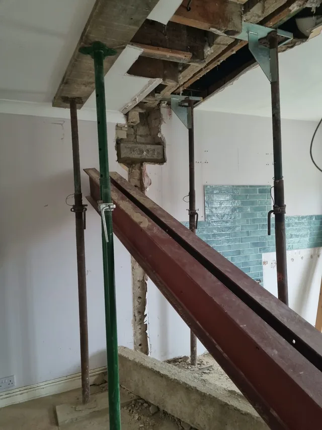 Steel beams and temporary supports during structural alterations to the kitchen