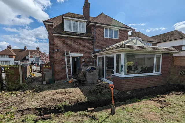 Foundation trenches beside the existing house and conservatory