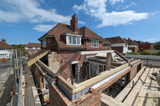 Extension walls and roof structure under construction