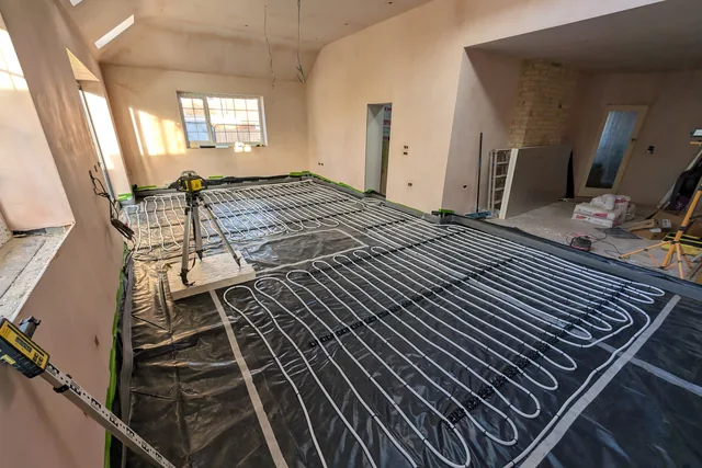 Wet underfloor heating pipework laid across the extension floor