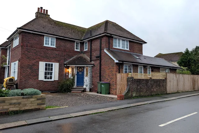 Front of the house and the extension running along its side
