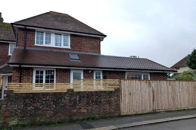 Side extension, boundary wall and timber fencing
