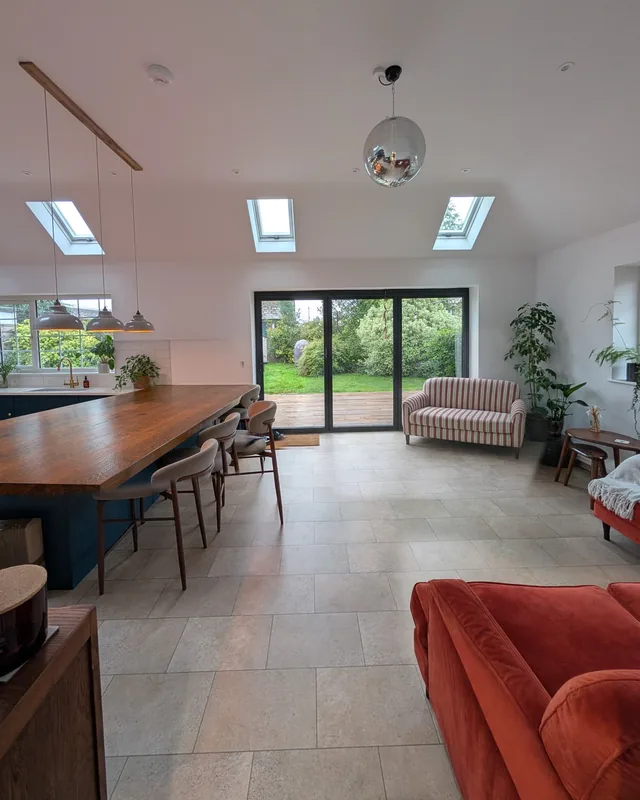 Open-plan kitchen and living space with rooflights and doors to the garden