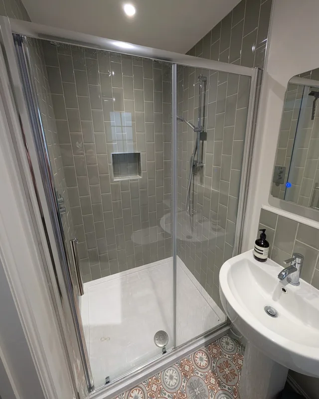 Tiled shower enclosure and basin